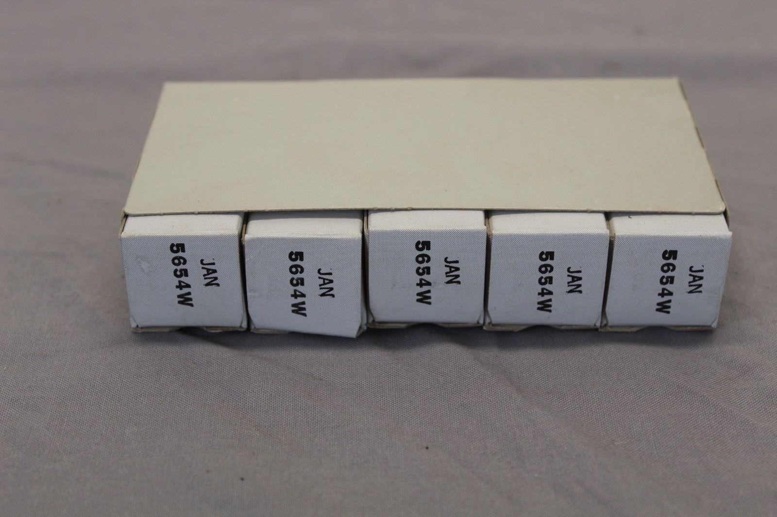 Sleeve of 5 vintage JAN 5654W electron tubes General Electric