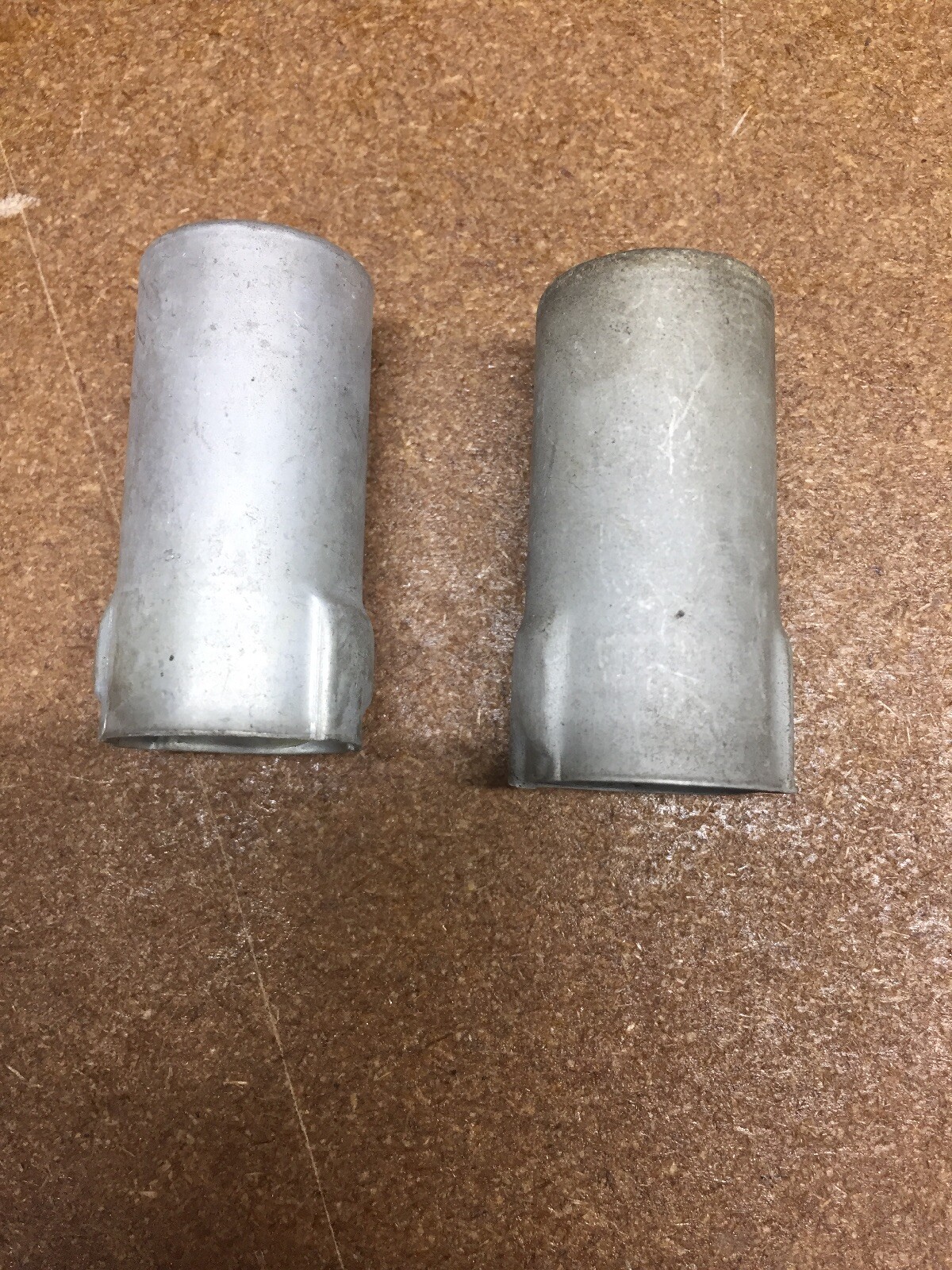 Pair of used twist-lock Vacuum tube shields 12AU6-sized.
